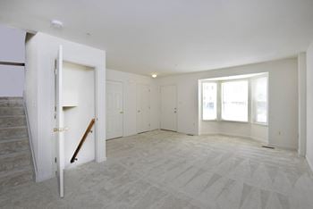 A bedroom with white walls 